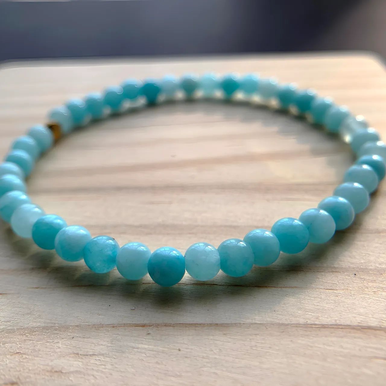 Close-up of aquamarine bracelet beads and stringing