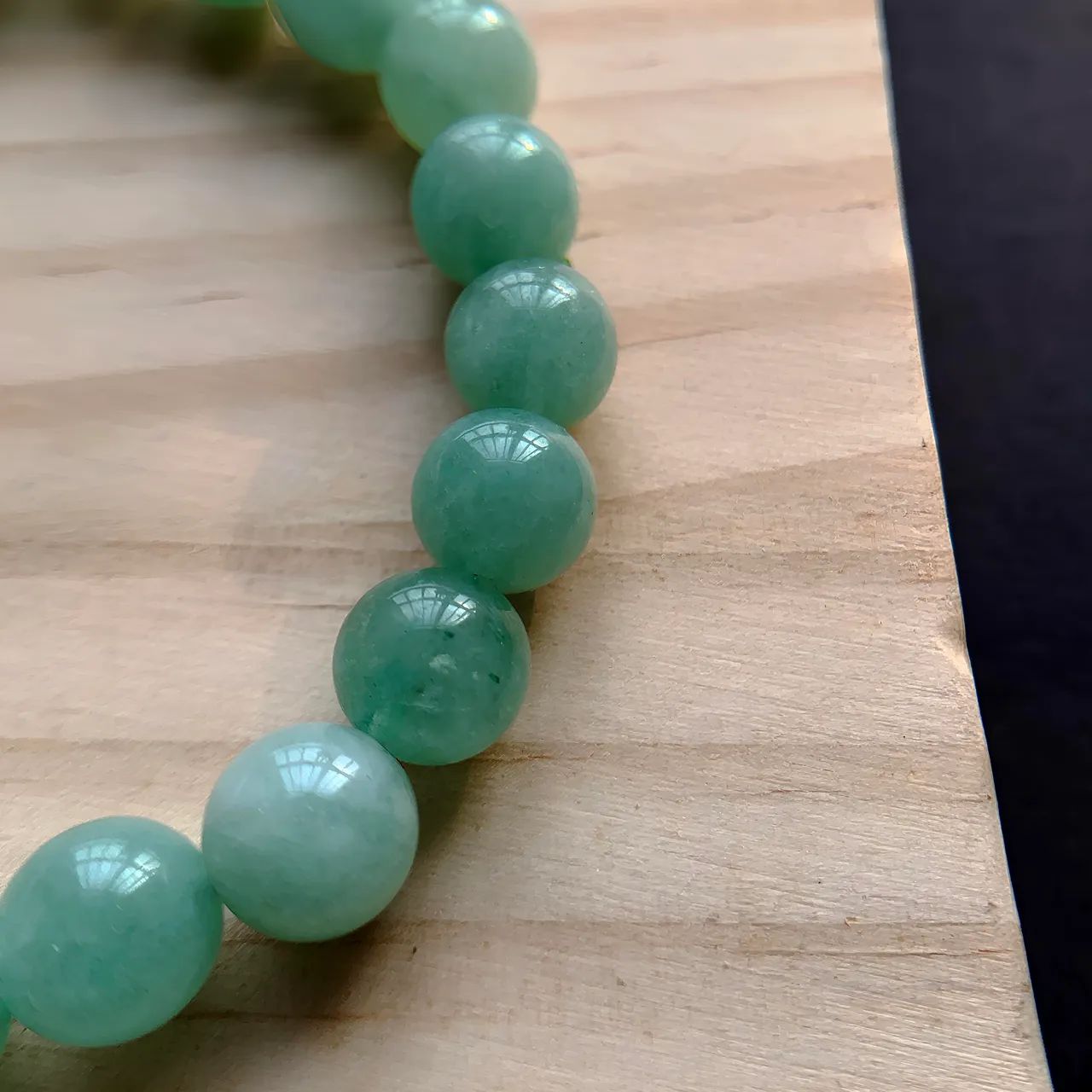 Burmese Jade Bracelet detail — natural mineral veins and polished jade surface