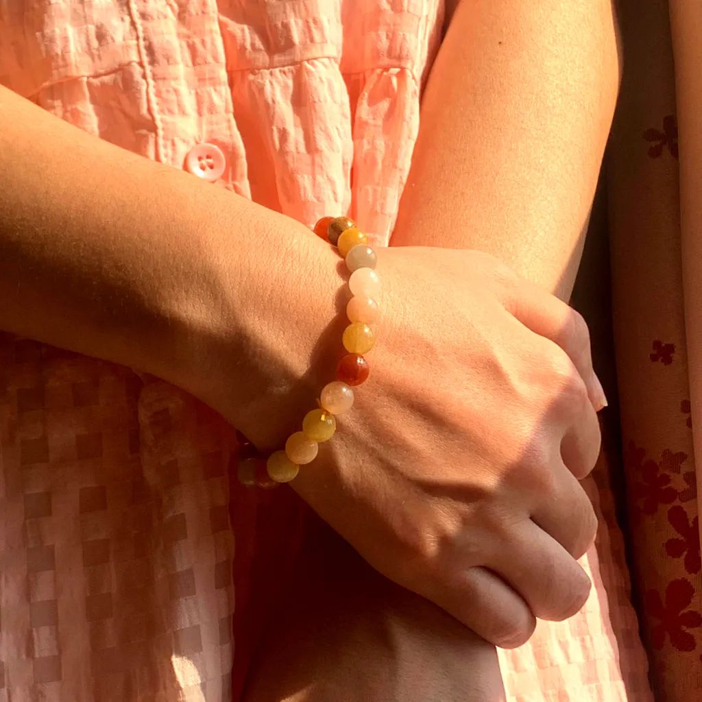 Golden Silk Jade bracelet worn on the wrist