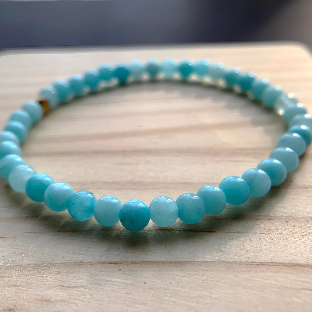 Close-up of aquamarine bracelet beads and stringing