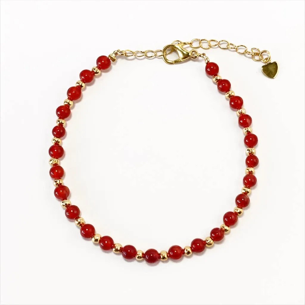 Carnelian bracelet — front view, warm orange carnelian beads on white background