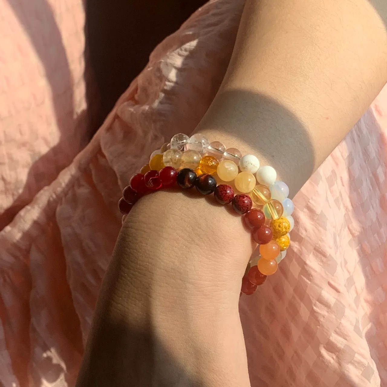 Metal Element Bracelet Layered Earth Element Bracelet and Fire Element Bracelet on the wrist — a stacked everyday styling