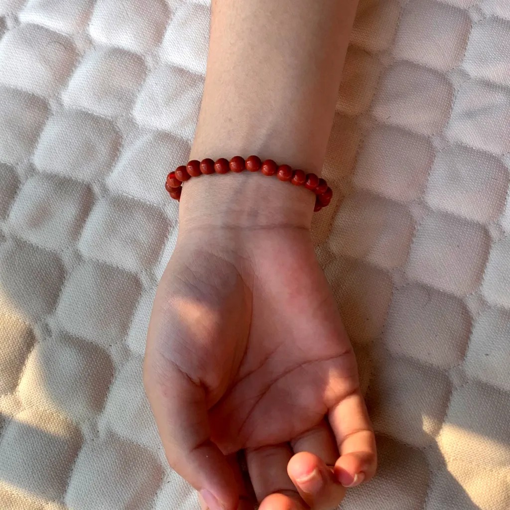 Red Jasper Bracelet worn on the wrist