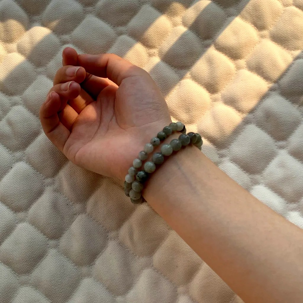6mm White Flash Stone Bracelet layered with 8mm White Flash Stone Bracelet on the wrist - a stacked everyday styling